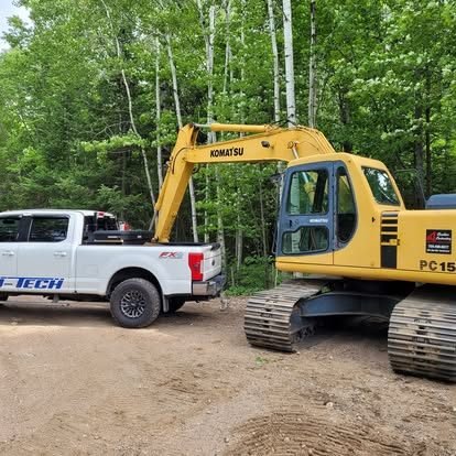 Heavy equipment and fleet service truck on site